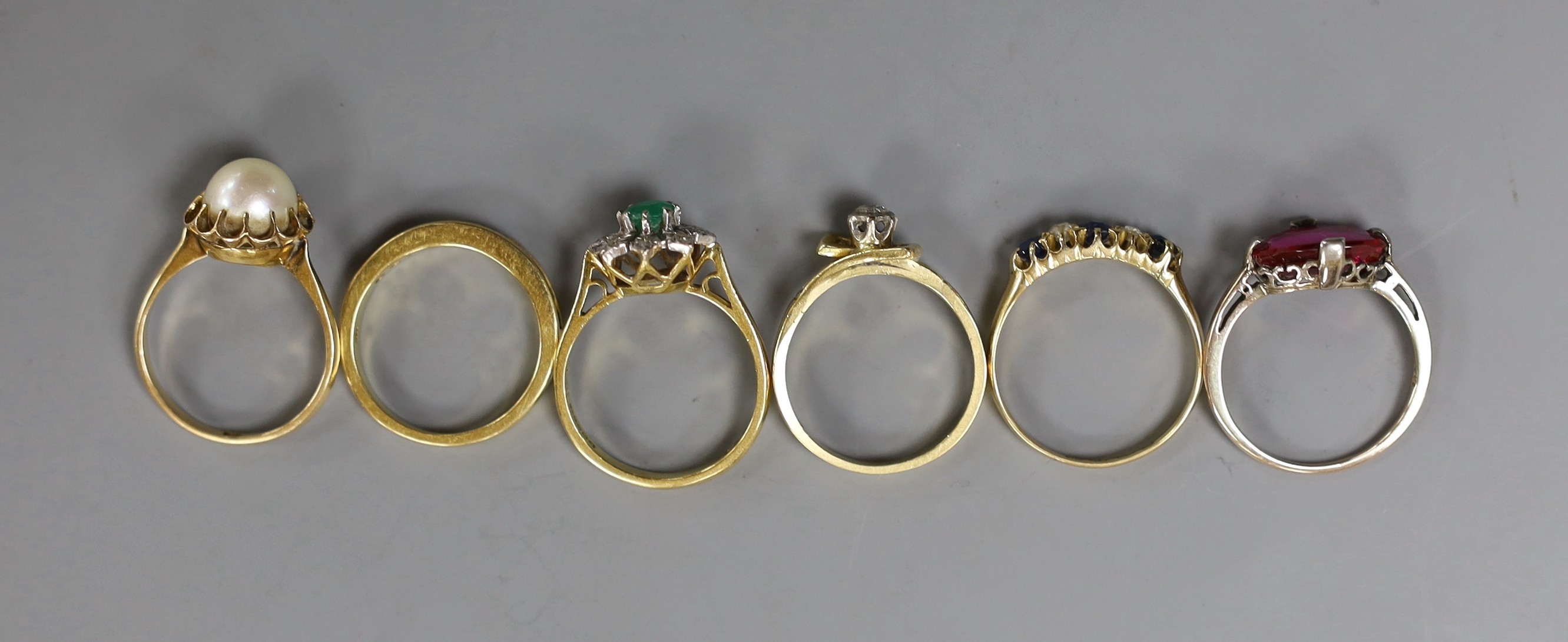 Five assorted 18ct and gem set ring including a Victorian sapphire and diamond set half hoop ring, gross weight 17.2 grams and a 585 and gem set ring, gross 2.6 grams.